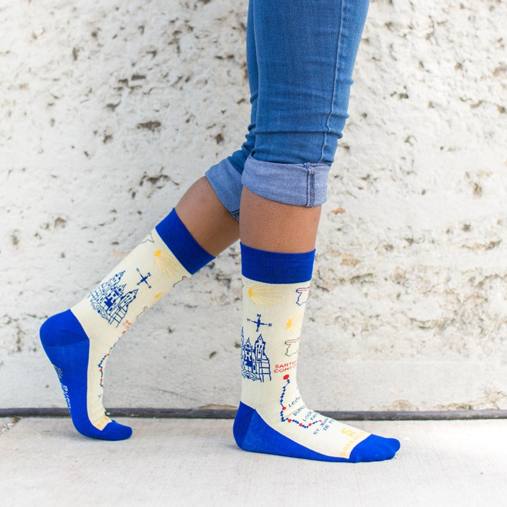 a person with blue jeans and white socks