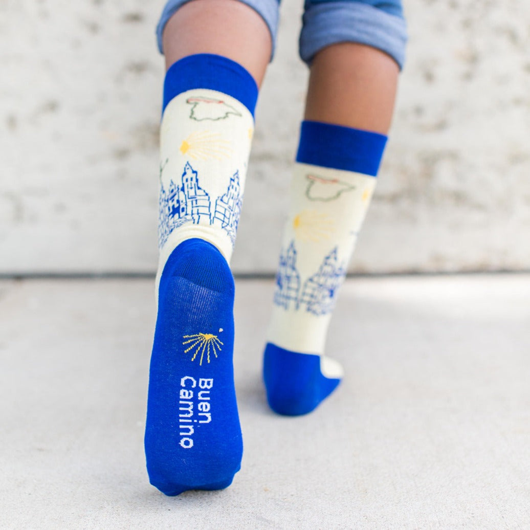a person wearing a pair of blue and white socks with a map on them