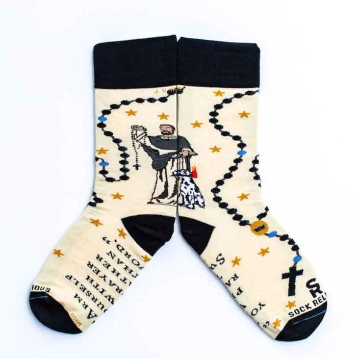 a pair of socks with a picture St. Dominic on it