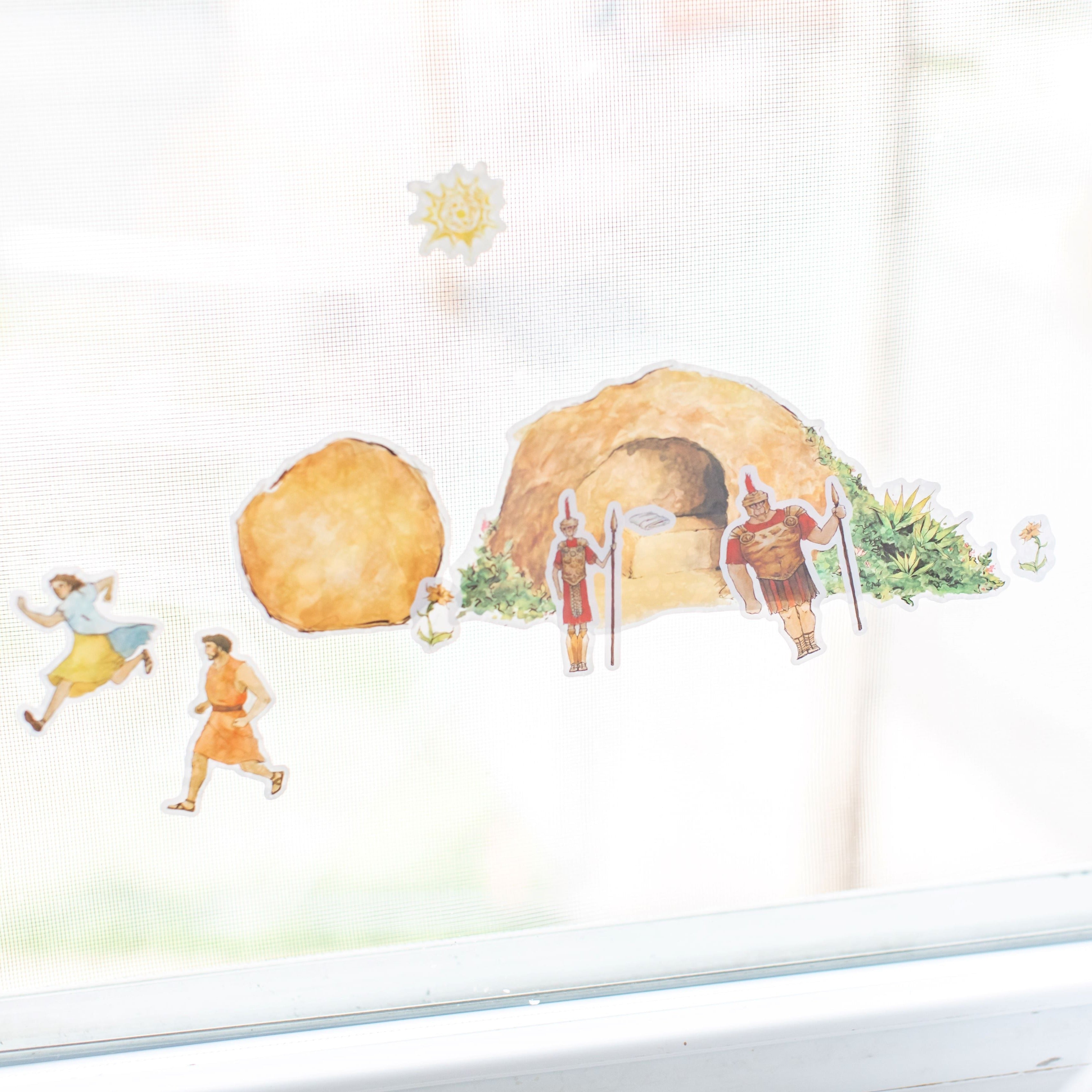 empty tomb cling set on a window