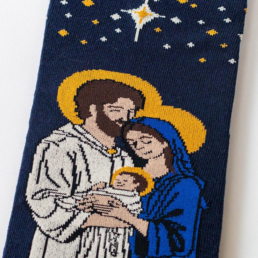 a blue socks with a picture of a man and woman holding a baby