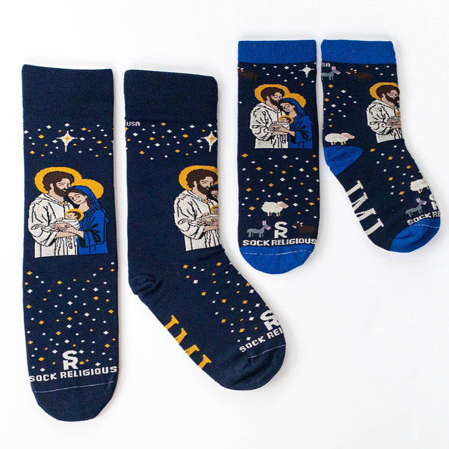 Two pairs of socks with the image of a man and woman holding a baby
