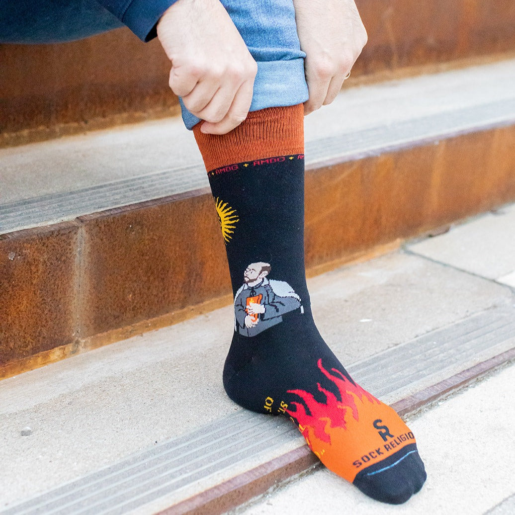 a person wearing a pair of socks with a picture of a man on it