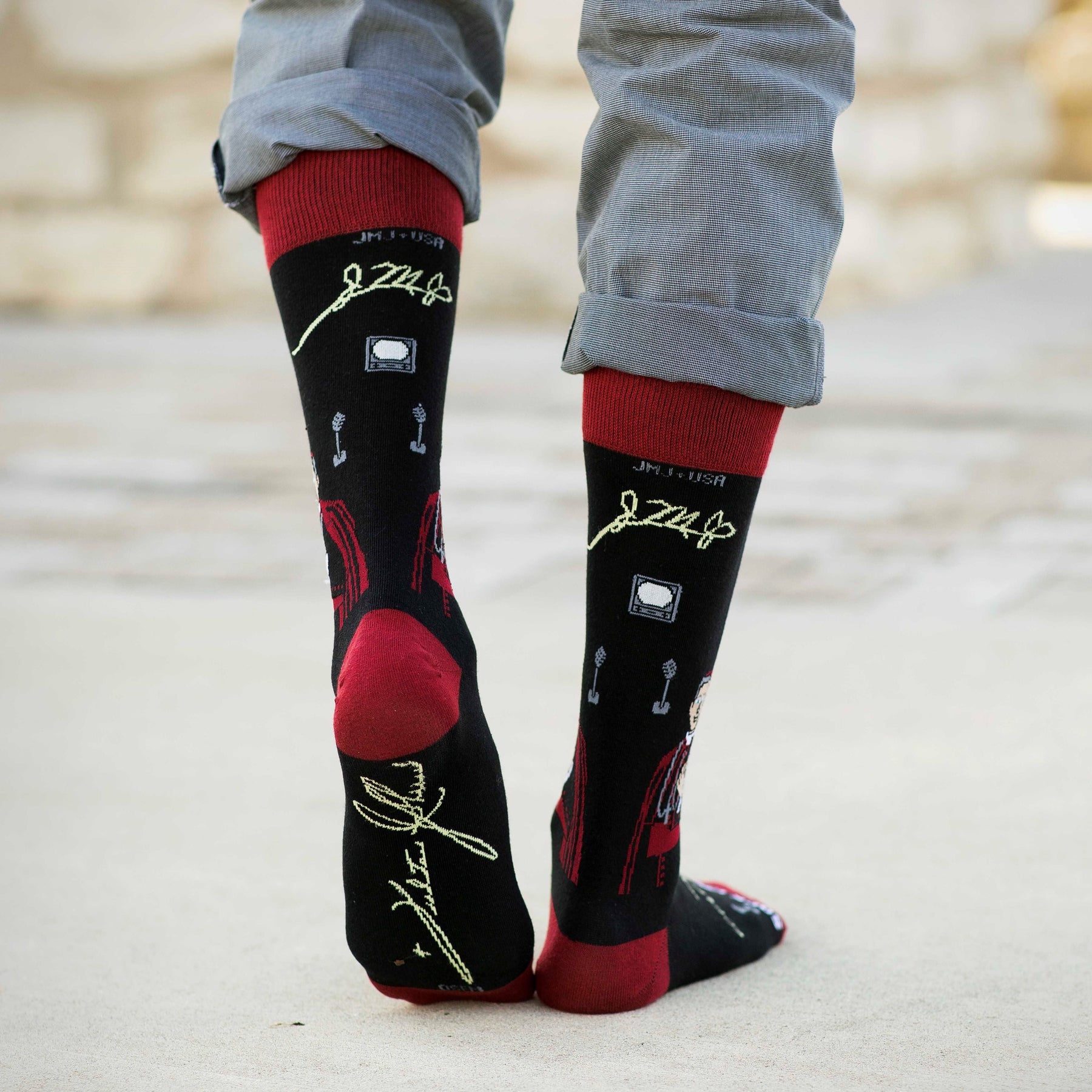 a person wearing a pair of socks with a picture on them