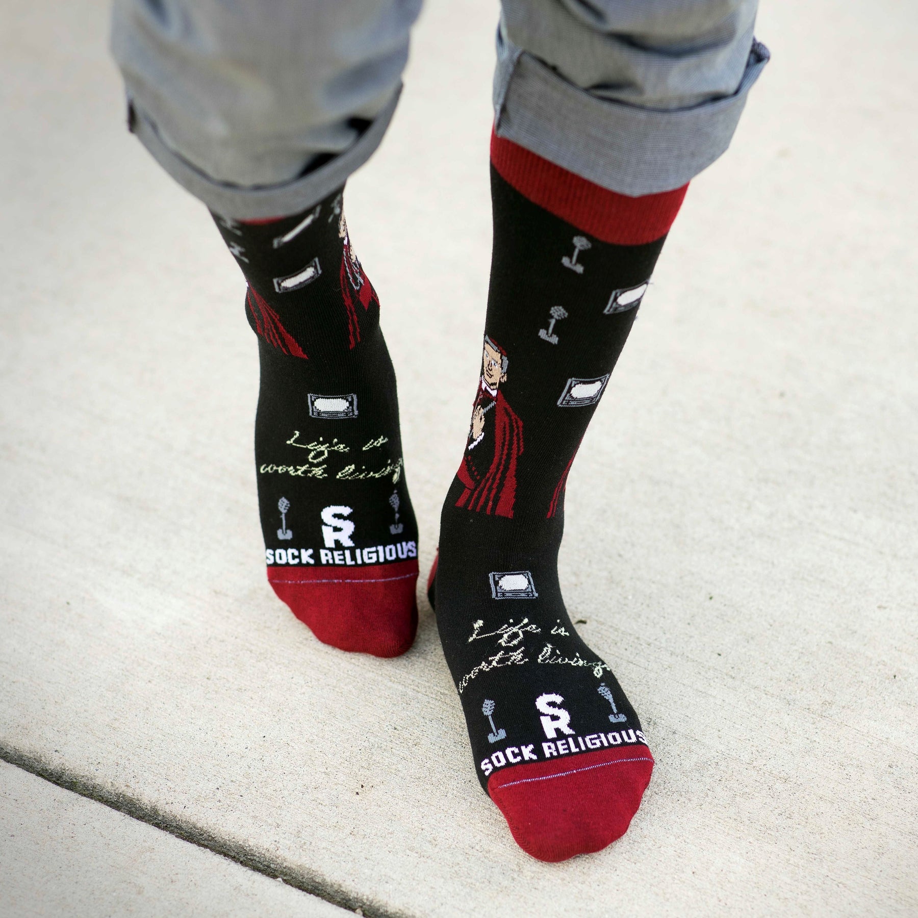 a person wearing a pair of socks with pictures on them