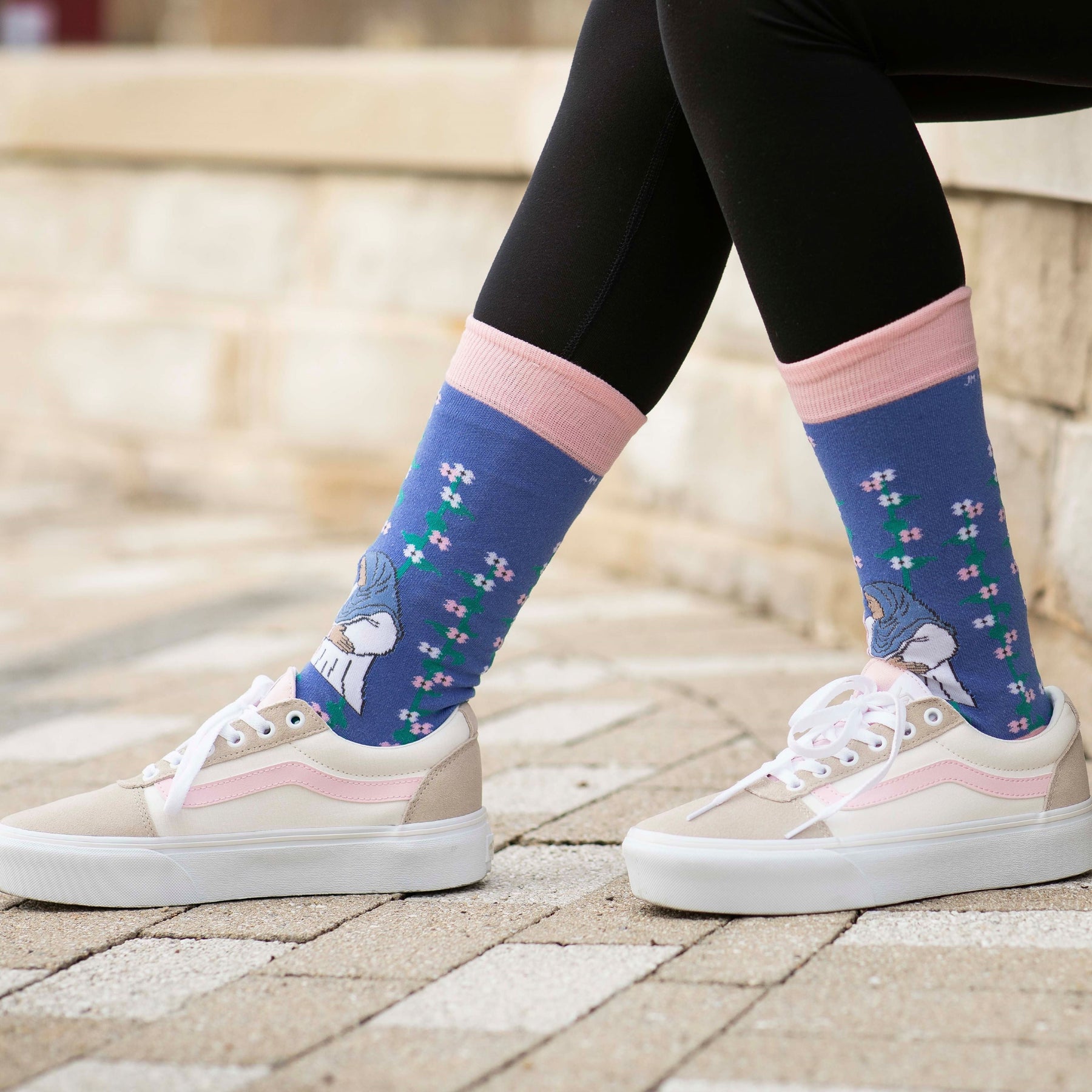 a woman's feet wearing a pair of socks with a picture of Mary and Elizabeth