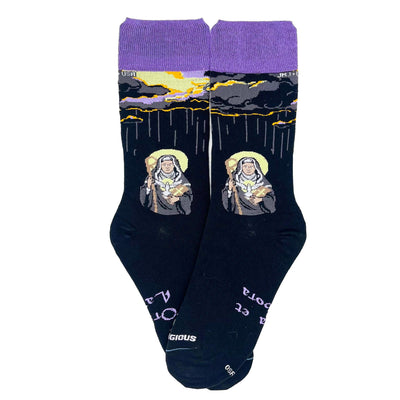 a pair of socks with a picture of St. Scholastica