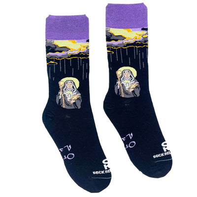 a pair of socks with a picture of St. Scholastica