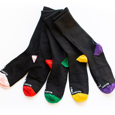 five pairs of socks with different colors on them