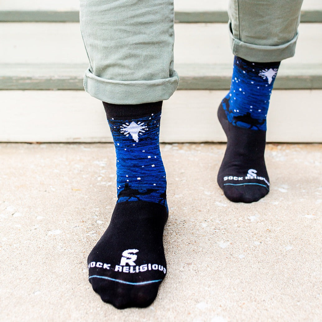 a pair of Three Wisemen socks with a picture of a star in the sky
