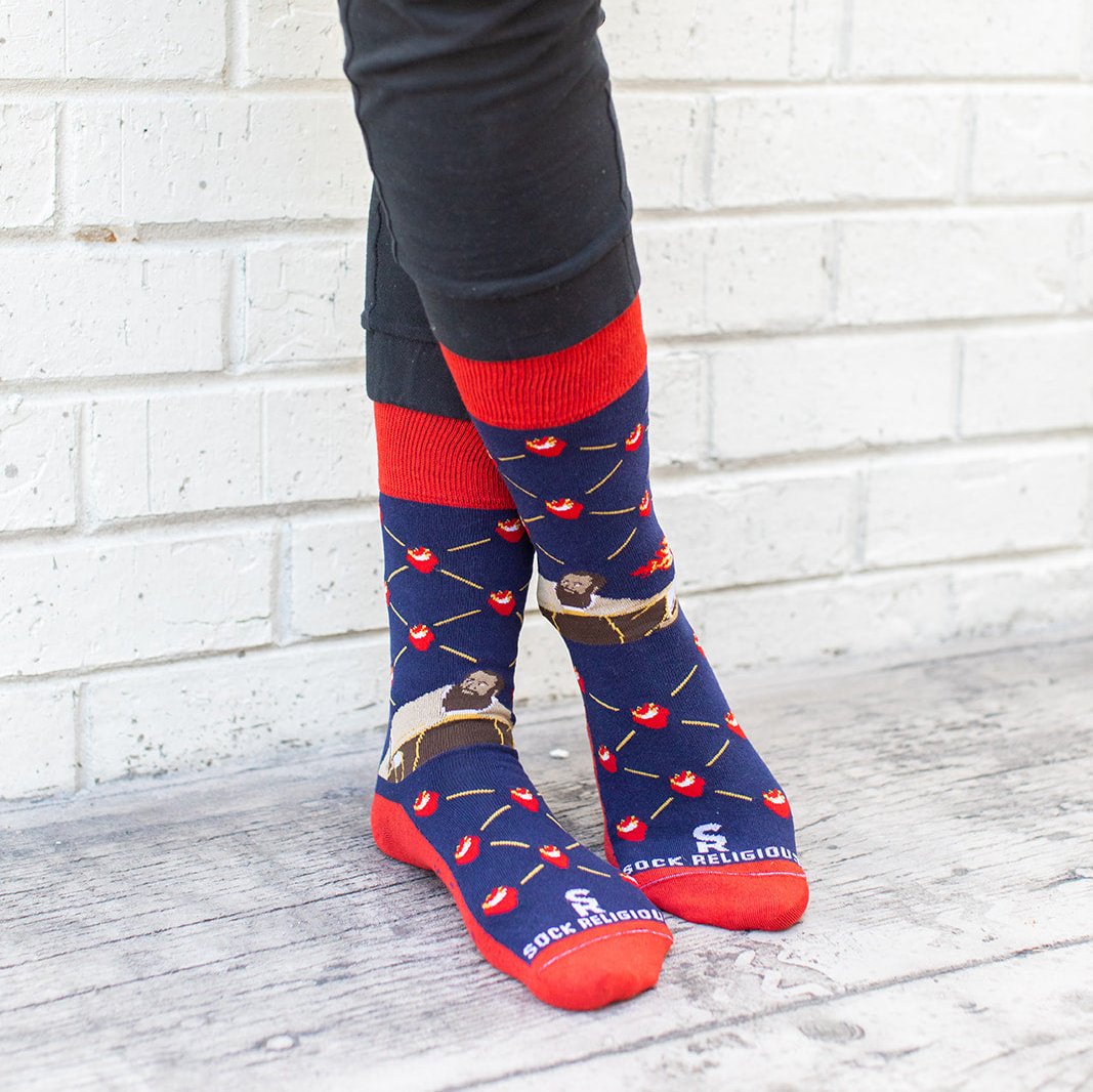 a person wearing a pair of socks with a picture St. Augustine