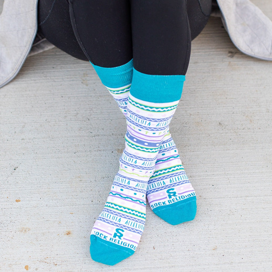 a person sitting on a bench wearing colorful socks