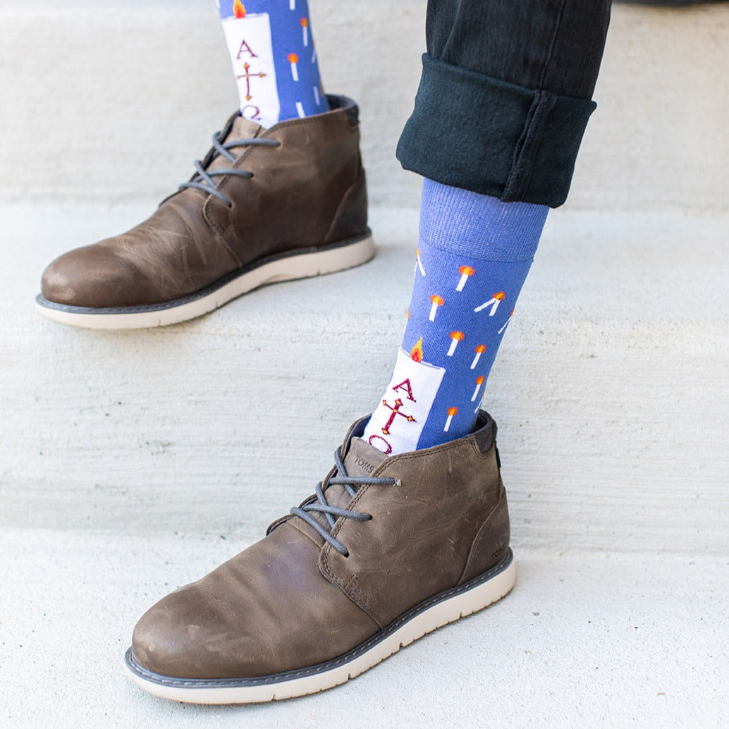 a person wearing a pair of brown shoes and socks