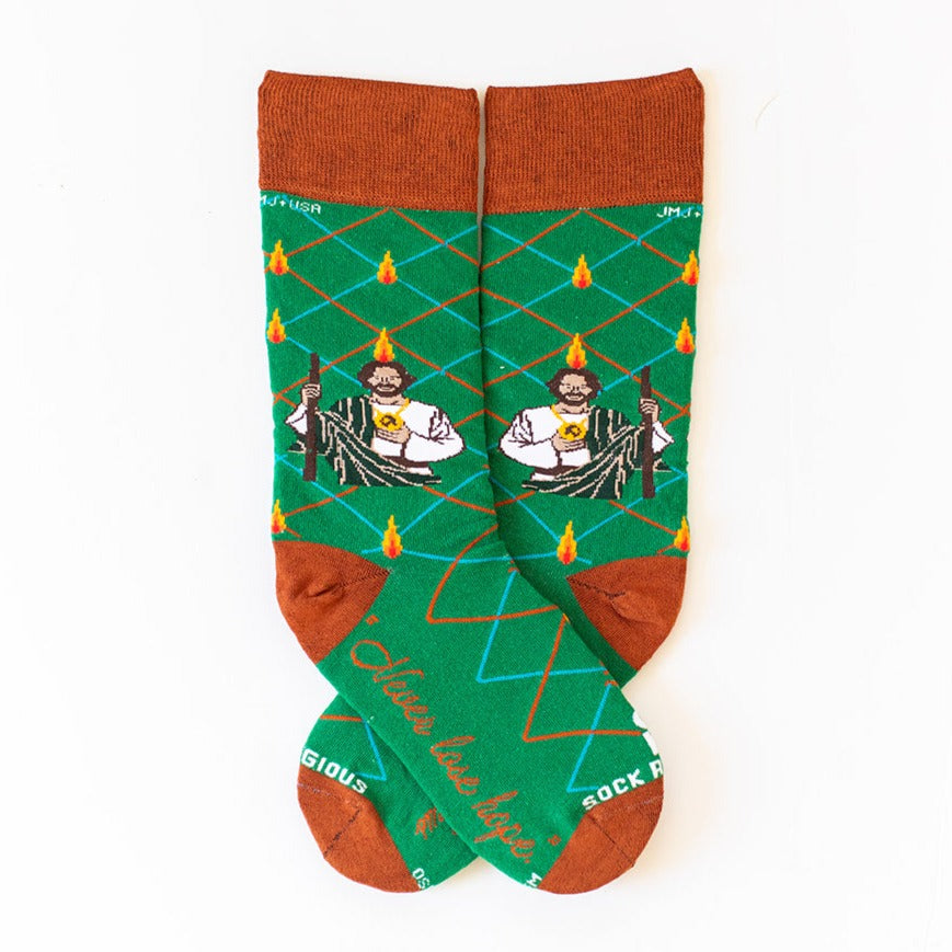 a pair of socks with a picture of St. Jude