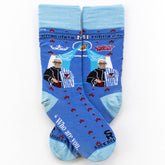 a pair of blue socks with a picture of St. Maximilian Kolbe