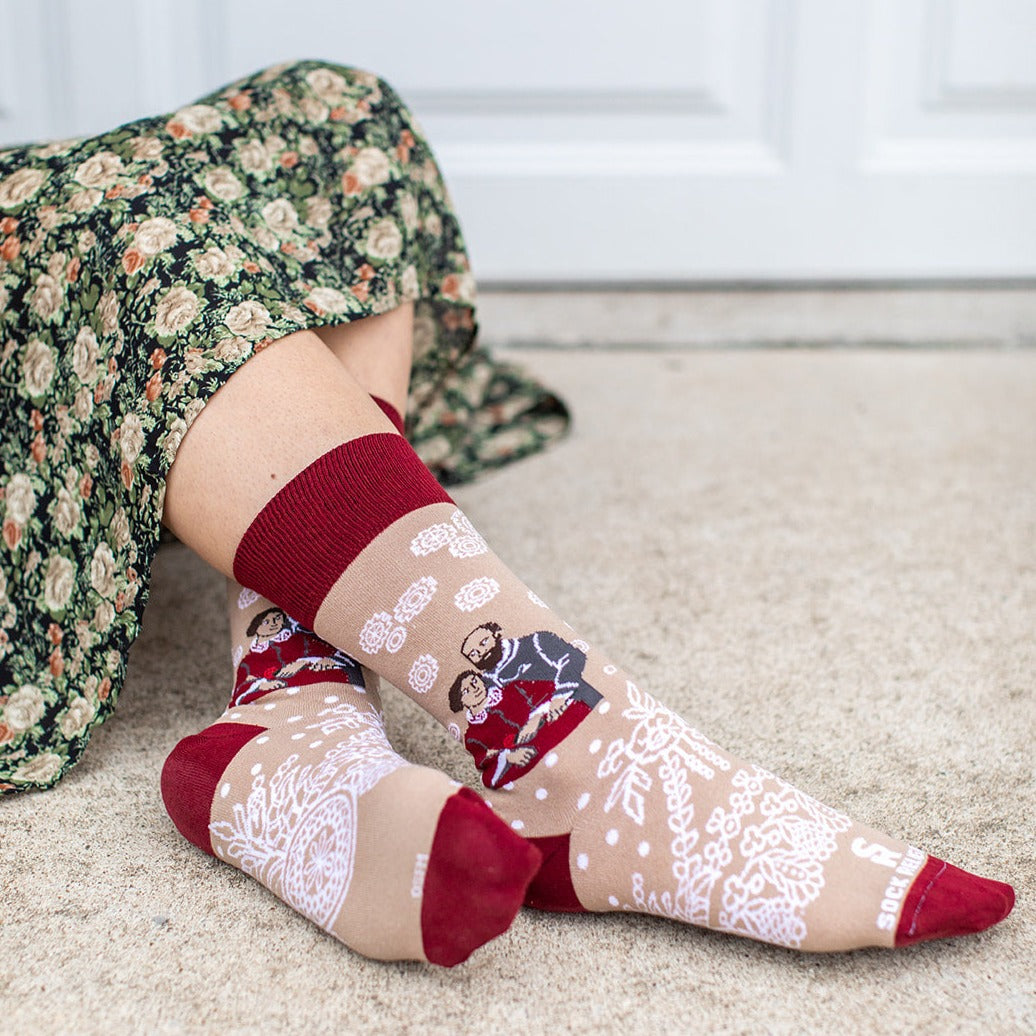 a woman sitting on the floor with her legs crossed