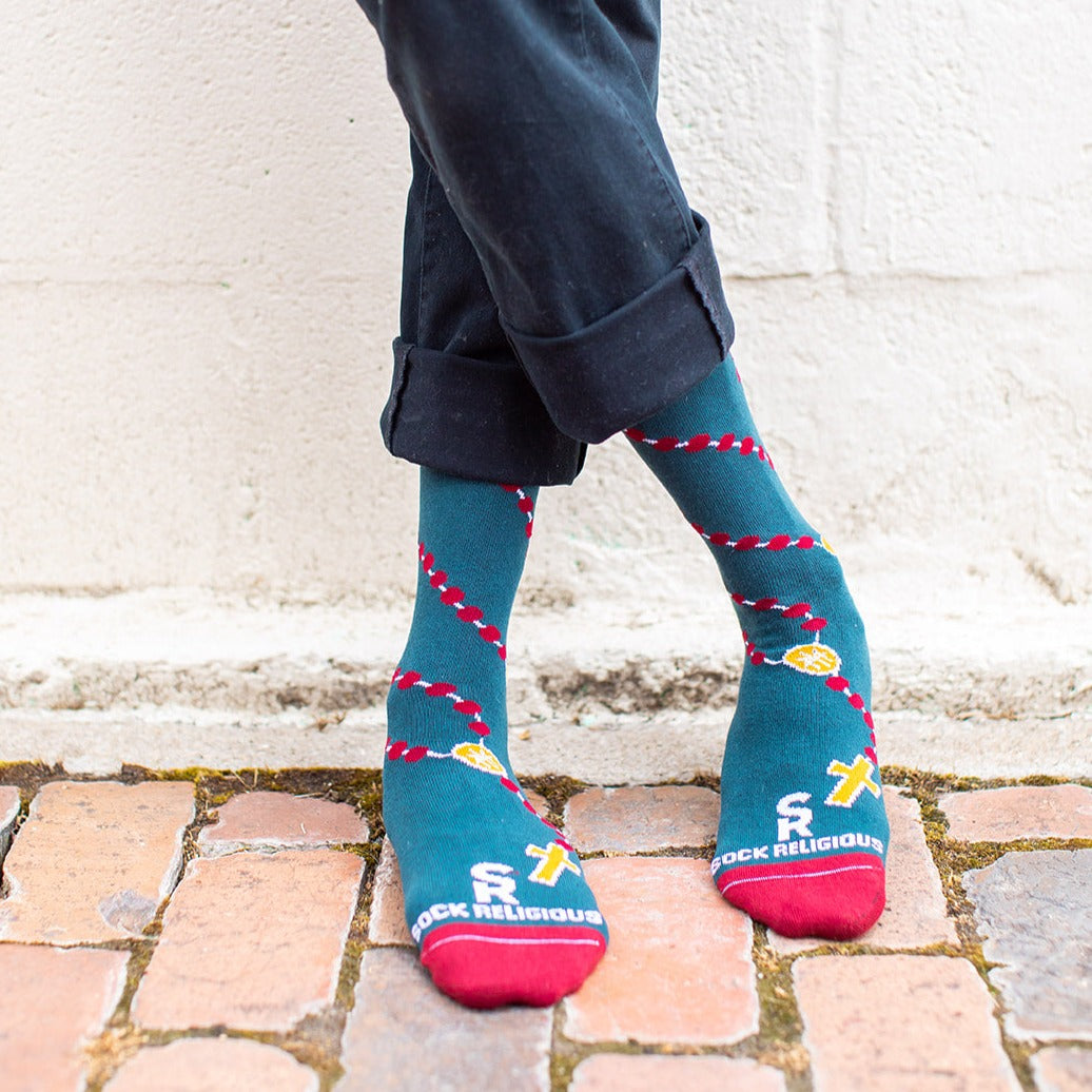a person wearing a pair of socks with a design of rosary