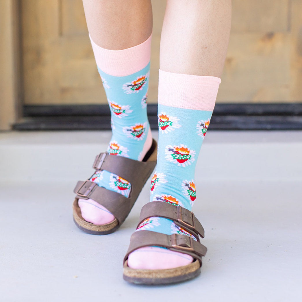 a person wearing a pair of sandals and socks