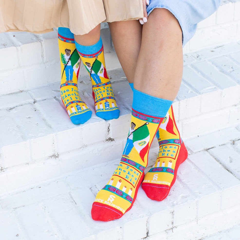 two person sitting on some steps