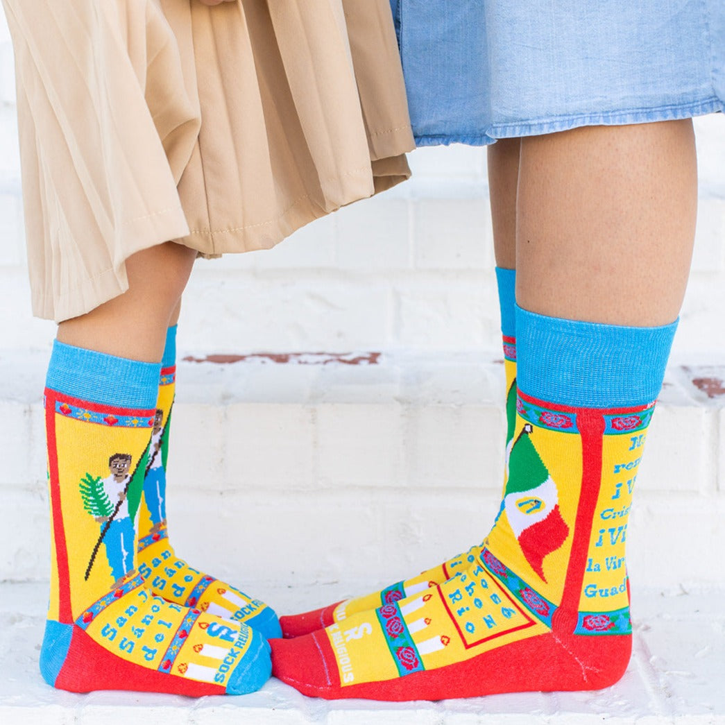 a pair of feet with colorful socks on