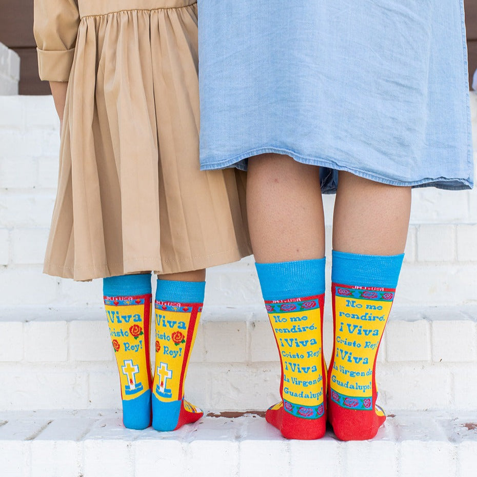 two person standing next to each other wearing a colorful socks