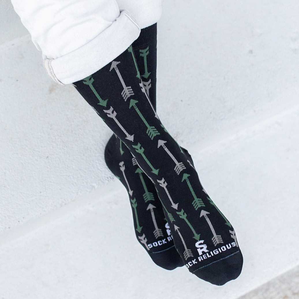 a person wearing socks with arrows and arrows on them