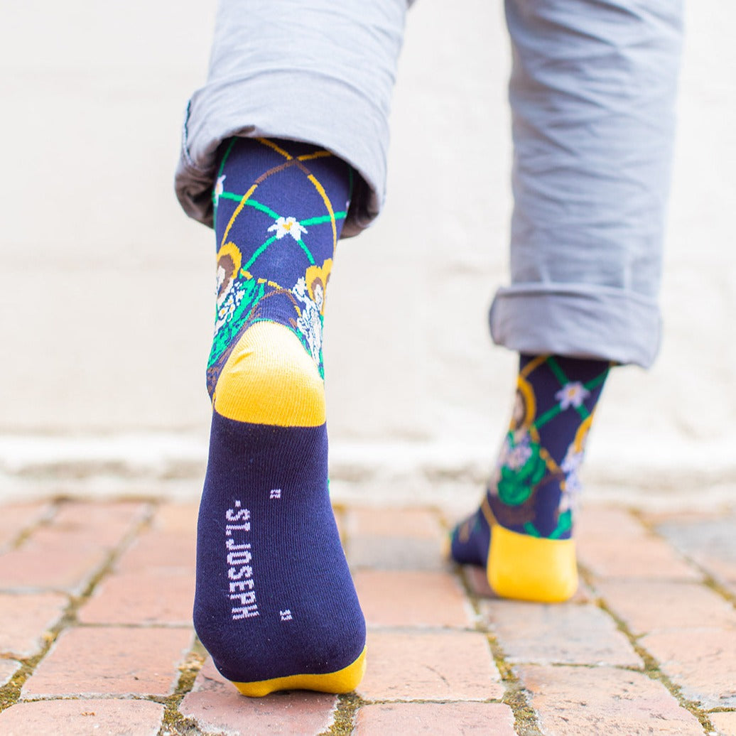 a person wearing St. Joseph socks, quote on bottom is empty because he didn't say anything in scripture