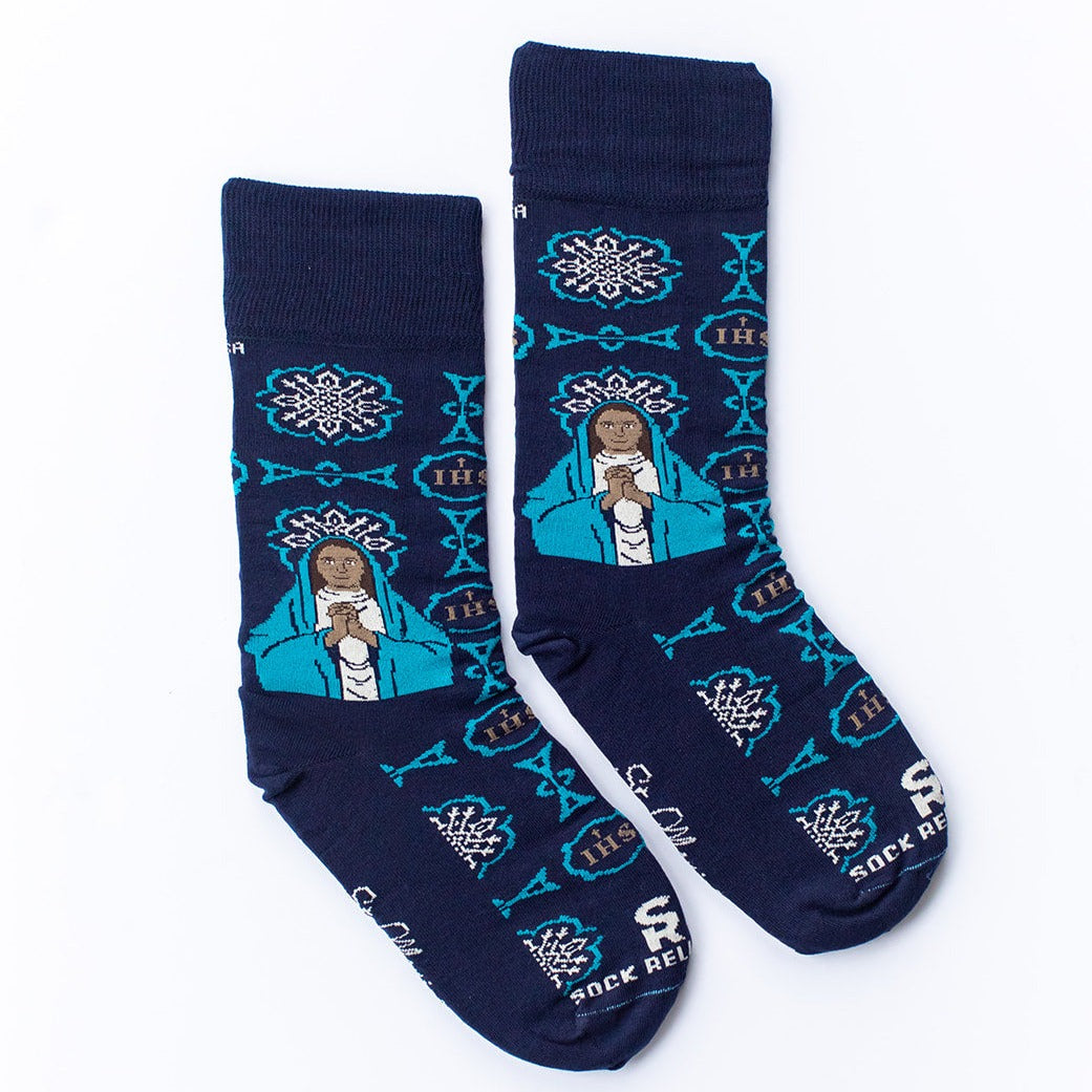 a pair of blue socks with a picture of St. Monica