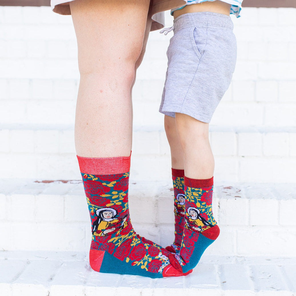 a mom and son standing on a step wearing St. Therese of Lisiuex socks