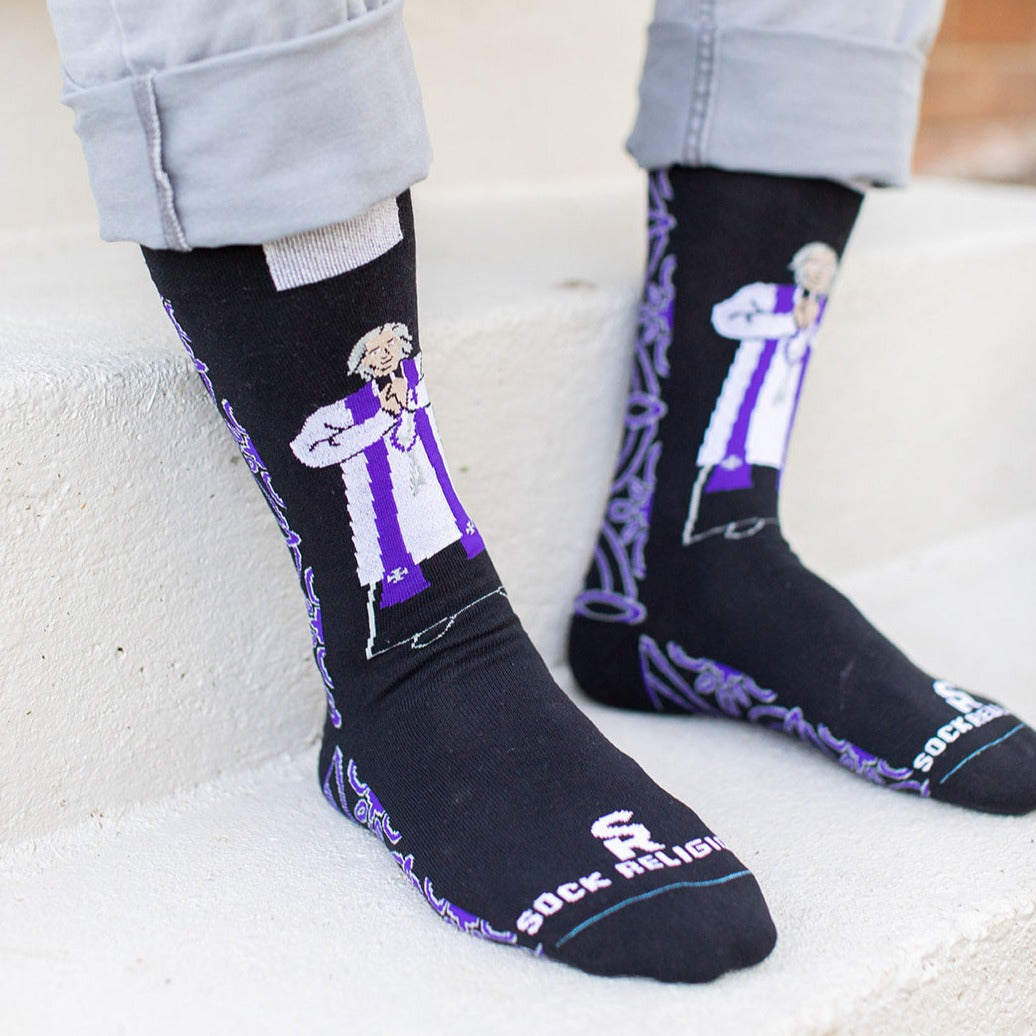 a person standing on a step wearing a pair of socks