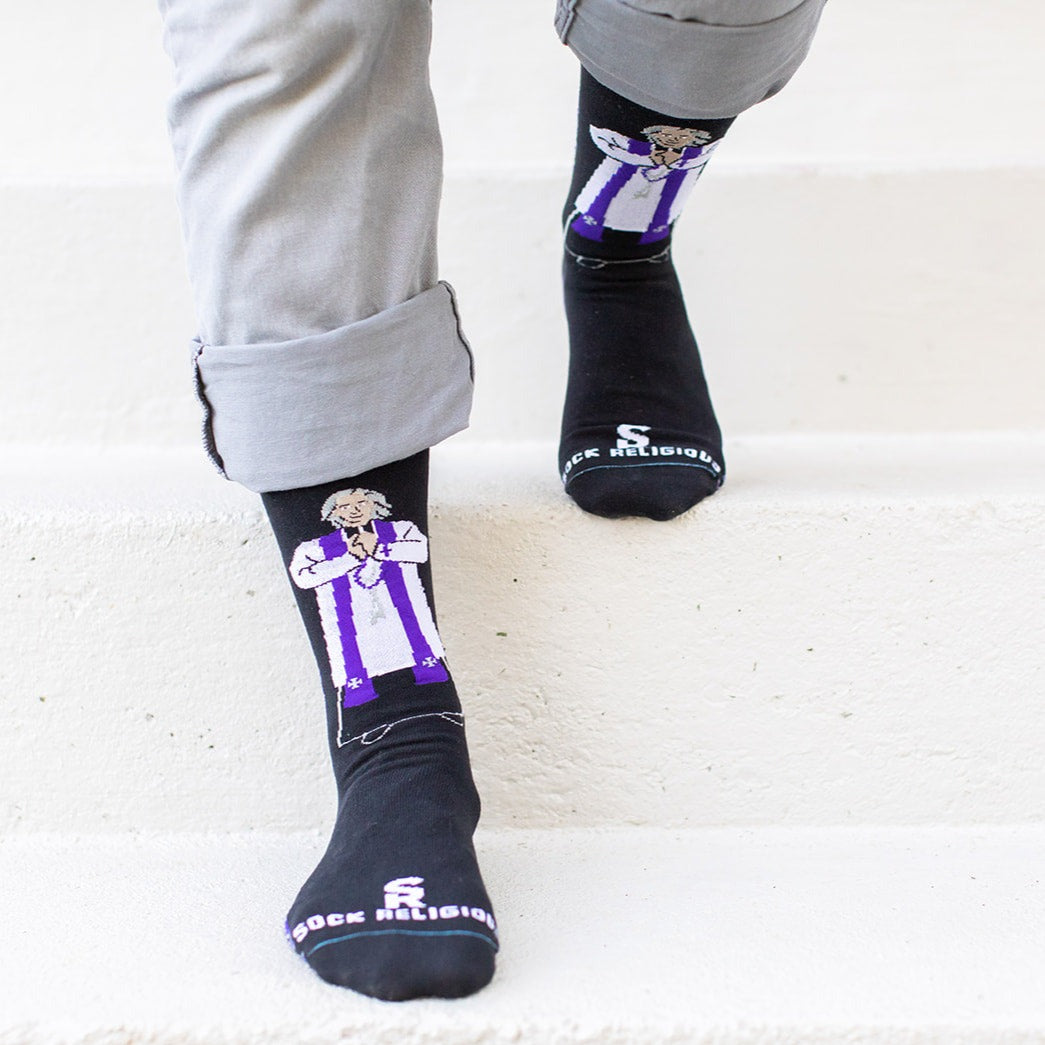 a person standing on a step with a pair of socks