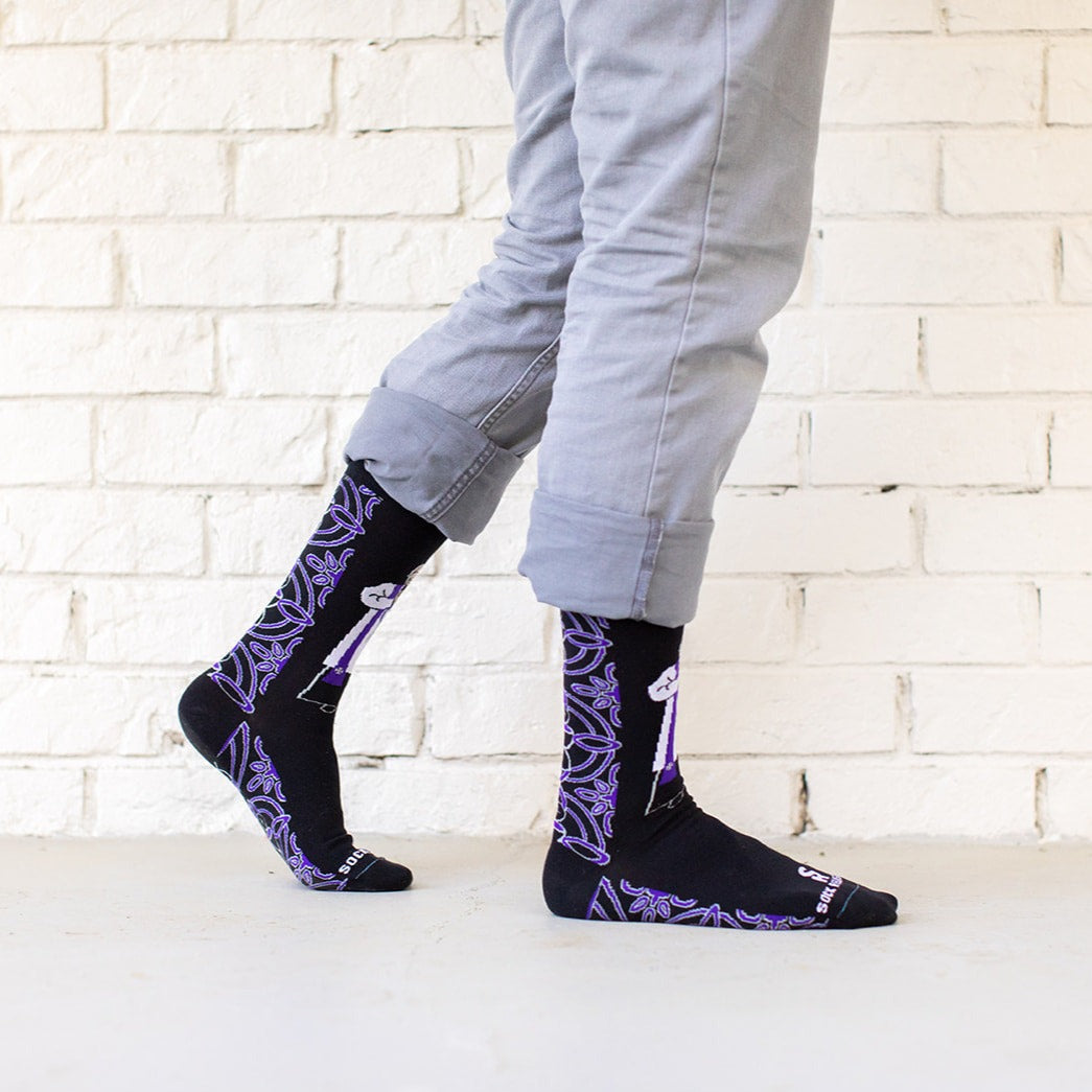 a person standing on a white brick wall
