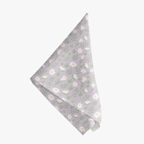 Light lilac Easter Alleluia napkin with simple white floral design, shown on a white background.
