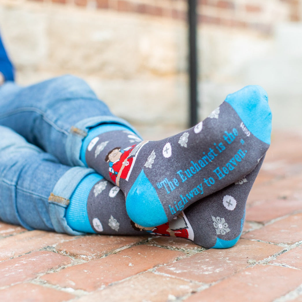 a person laying on the ground with their feet up