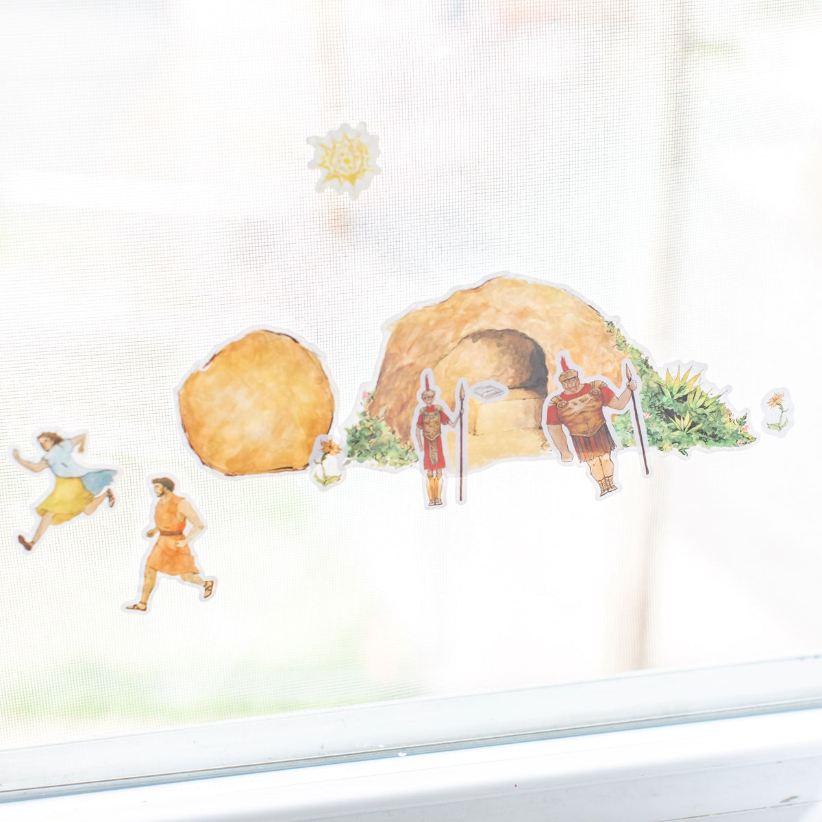  empty tomb cling set on a window