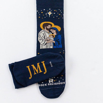 a pair of socks with a picture of a man woman holding a baby