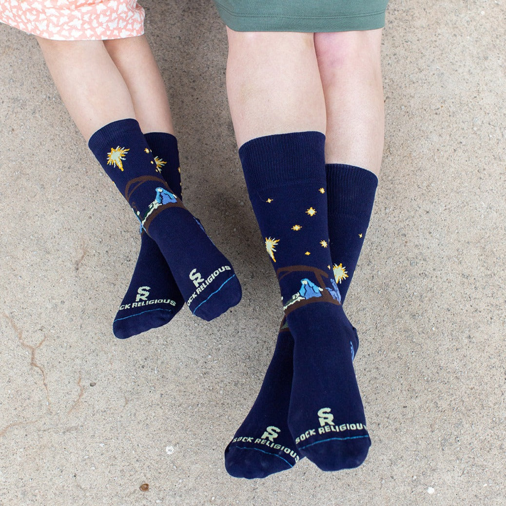 mother and child wearing matching nativity socks