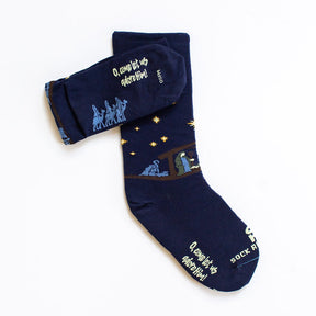 a pair of socks with a nativity scene on them