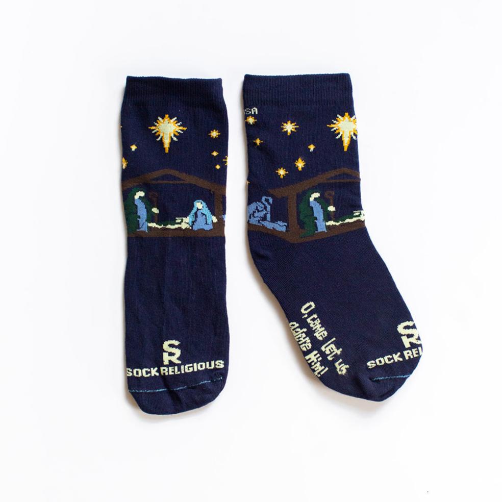 dark navy blue socks featuring simple silhouettes of the manger scene