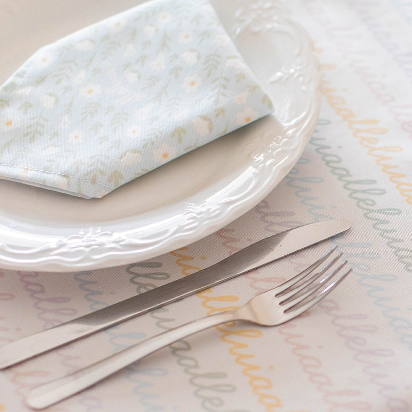 light blue colored napkin placed on a table setting 