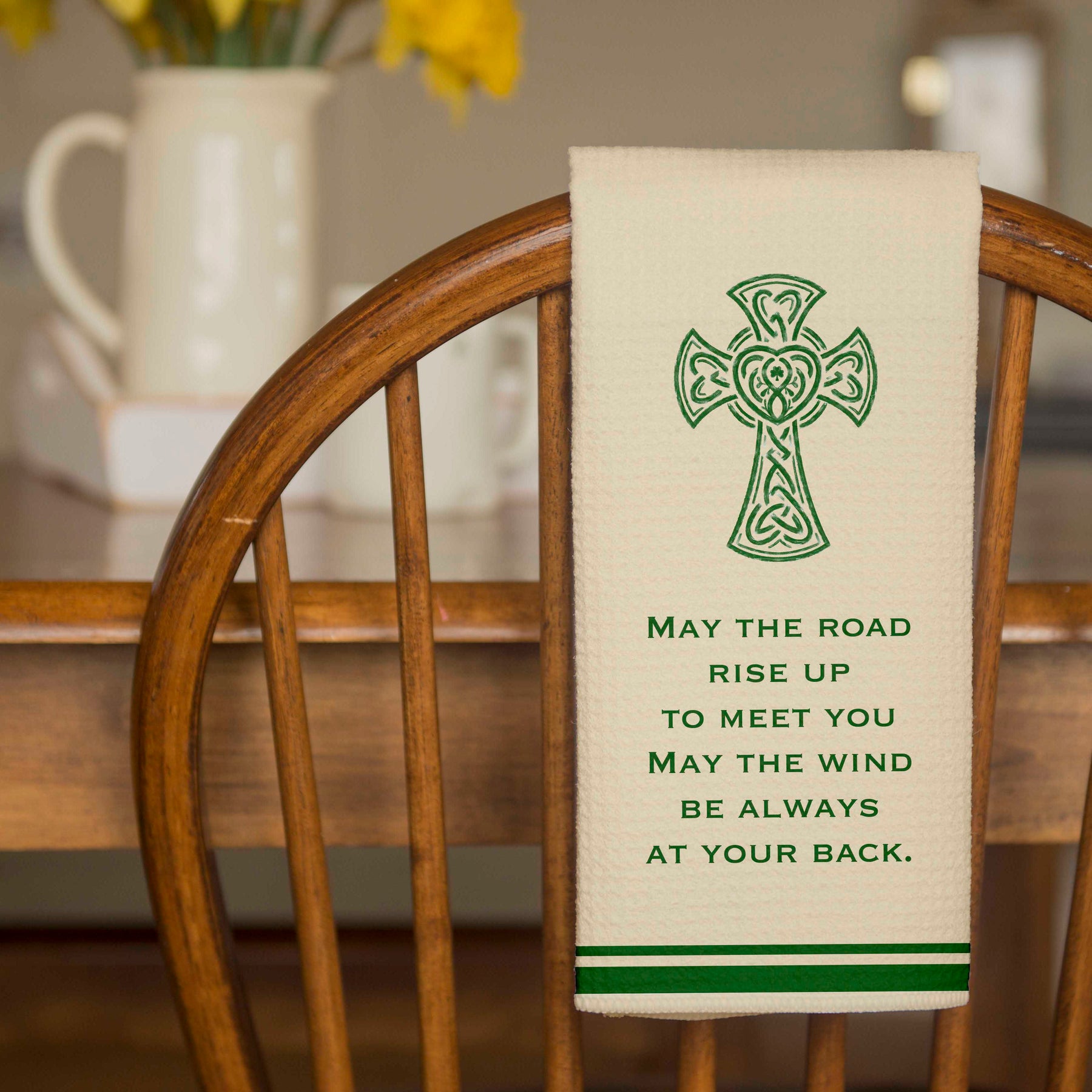 Irish Blessing Dish Towel with High Cross and words "May the road rise up to meet you may the wind be always at your back" - hanging over a chair