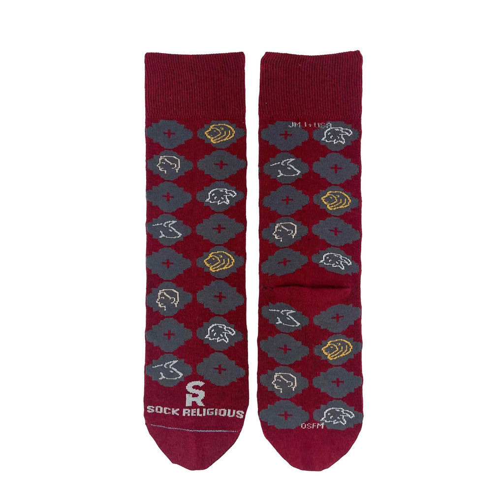 a pair of red socks with a pattern design on it