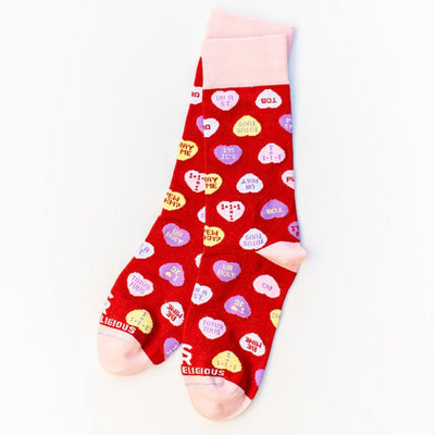 a pair of red socks with hearts on them