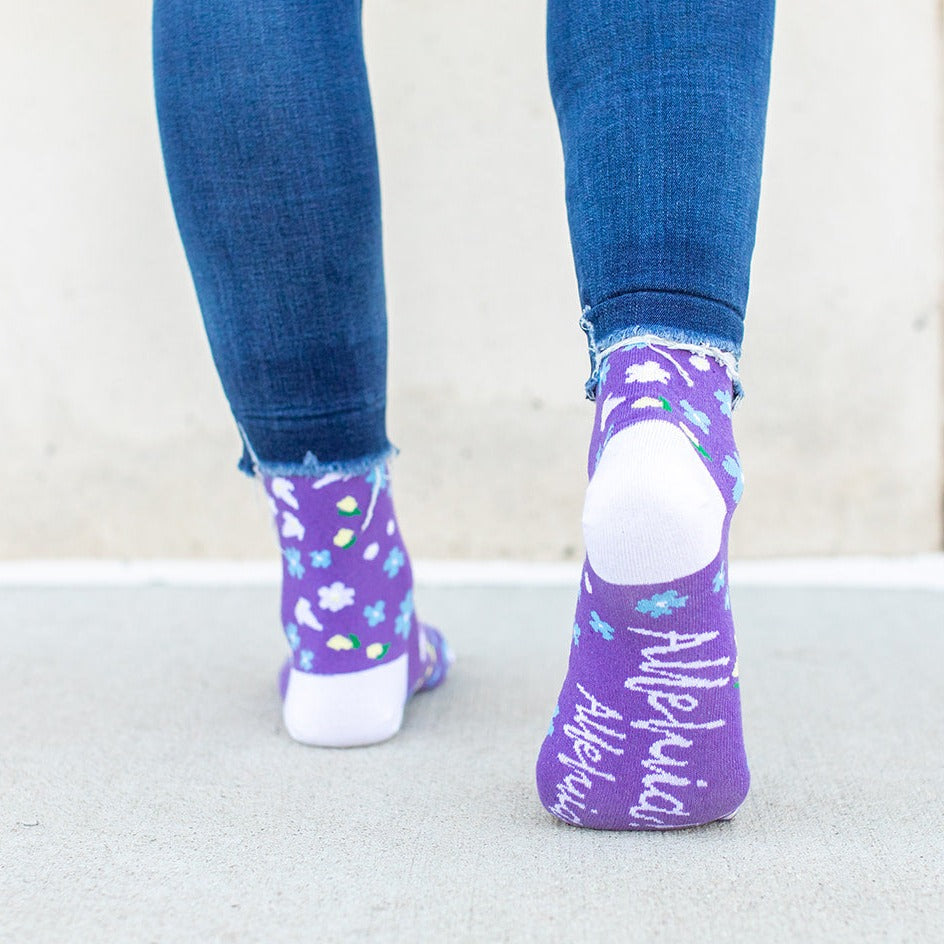 a close up of a person wearing purple socks