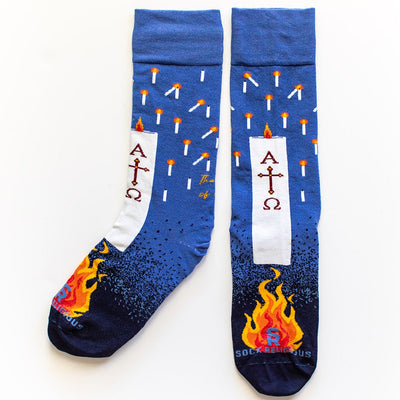 a pair of blue socks with candles on them