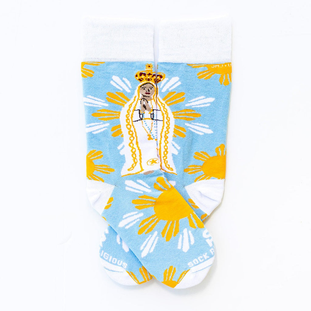 a pair of socks with a picture of a woman wearing a crown