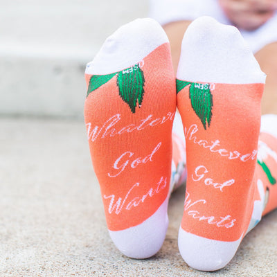 a close up of a person wearing a pair of socks with a pricture of St. Gianna Molla
