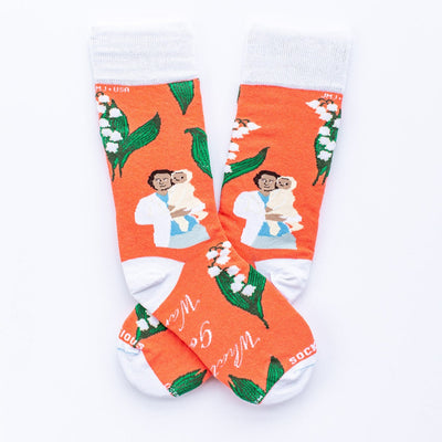 a pair of socks with a pricture of St. Gianna Molla