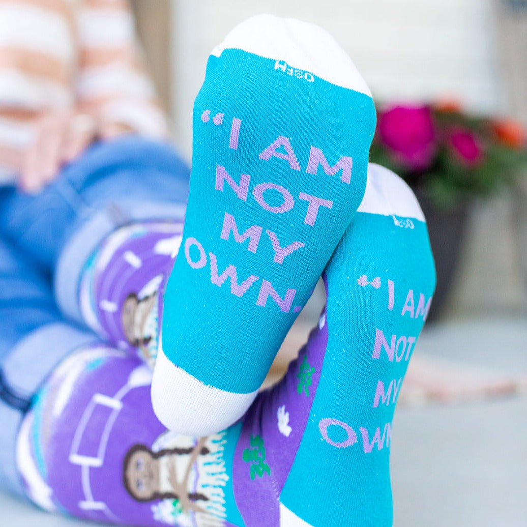 a pair of socks that say i am not my own