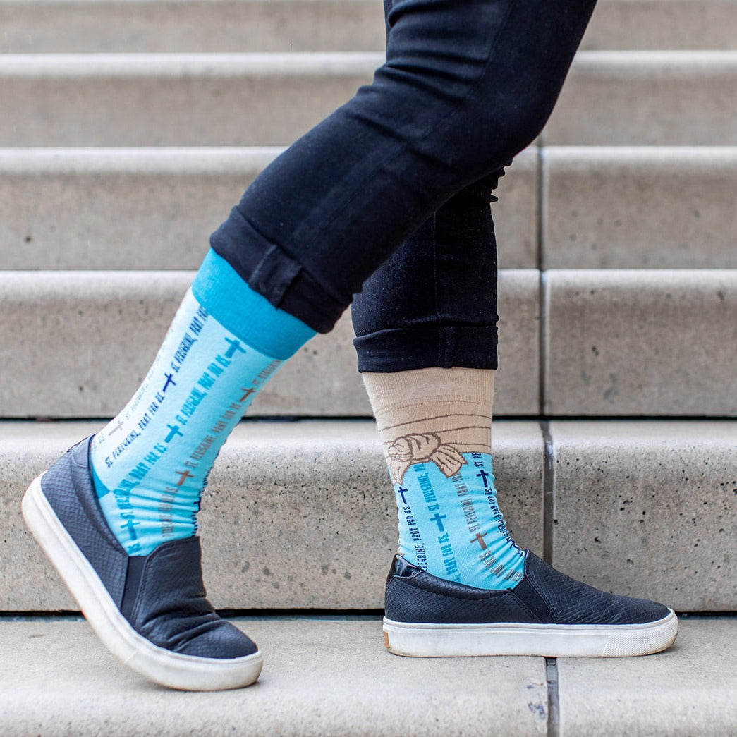 a person standing on a set of stairs with their feet up